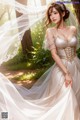 A woman in a wedding dress standing in the woods.