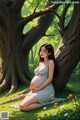 A pregnant woman sitting under a tree in a field of flowers.